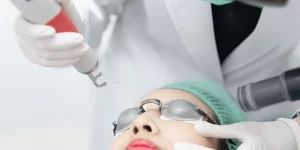 Woman receiving pico laser facial treatment 600nw