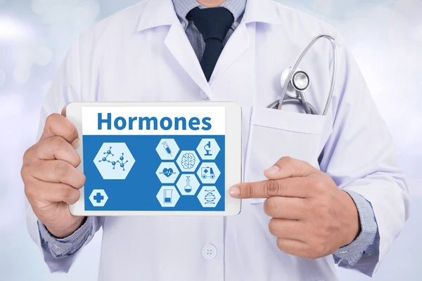 Doctor reviewing hormone information on a digital display